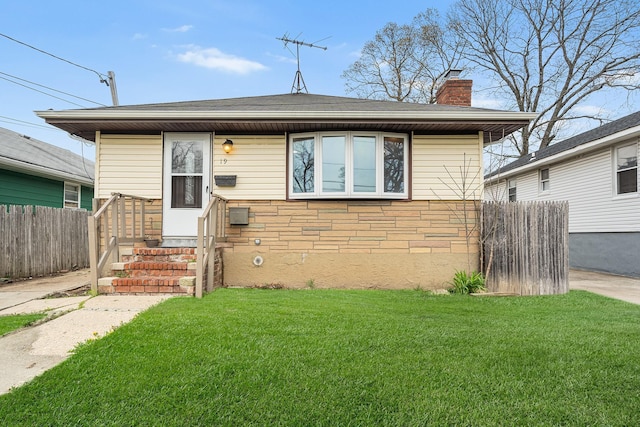 bungalow-style home with a front yard, a chimney, and fence