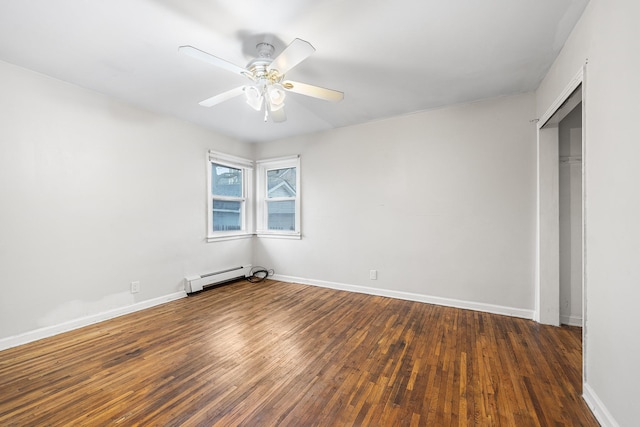 unfurnished bedroom with hardwood / wood-style flooring, a baseboard heating unit, a closet, ceiling fan, and baseboards