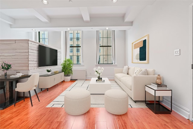 living room with beamed ceiling, recessed lighting, and wood finished floors