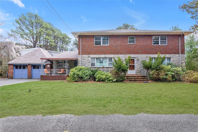 420 Old Country Rd, Melville, NY 11747 - view of front of house featuring a front lawn, driveway, covered porch, stone siding, and a garage