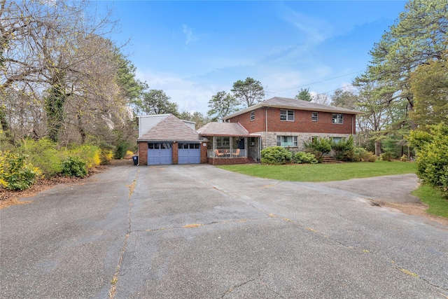 420 Old Country Rd, Melville, NY 11747 - view of front of property with brick siding, a front lawn, driveway, and a garage