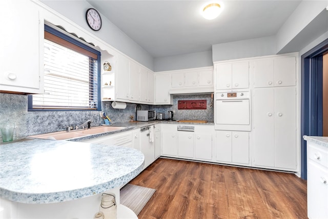 420 Old Country Rd, Melville, NY 11747 - kitchen featuring white cabinets, white oven, and light countertops