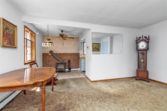 420 Old Country Rd, Melville, NY 11747 - dining area with a wood stove, a ceiling fan, baseboards, a baseboard radiator, and carpet flooring