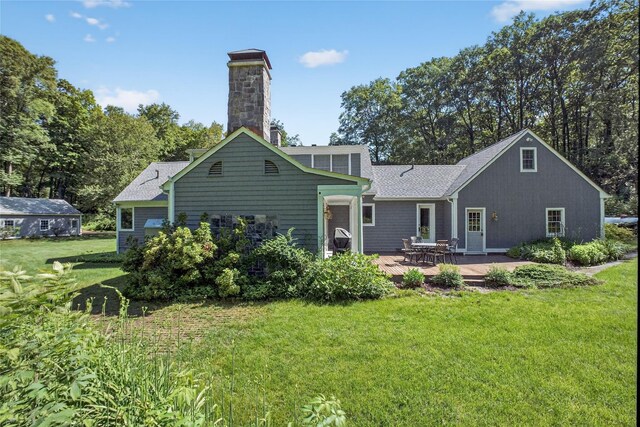 41 Lavelle Rd, Holmes, NY 12531 - back of house with a lawn, a chimney, and roof with shingles