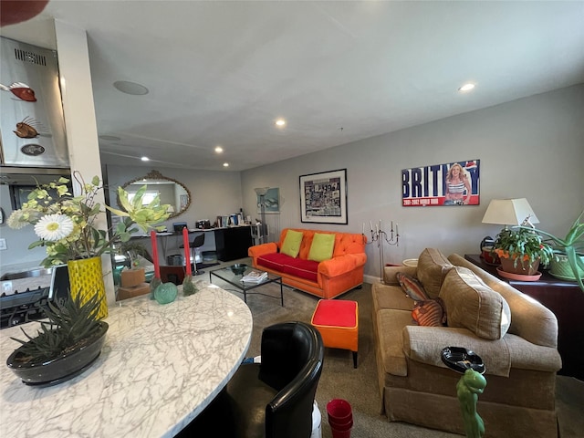 living room with carpet flooring and recessed lighting