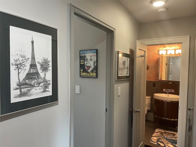 corridor featuring tile walls