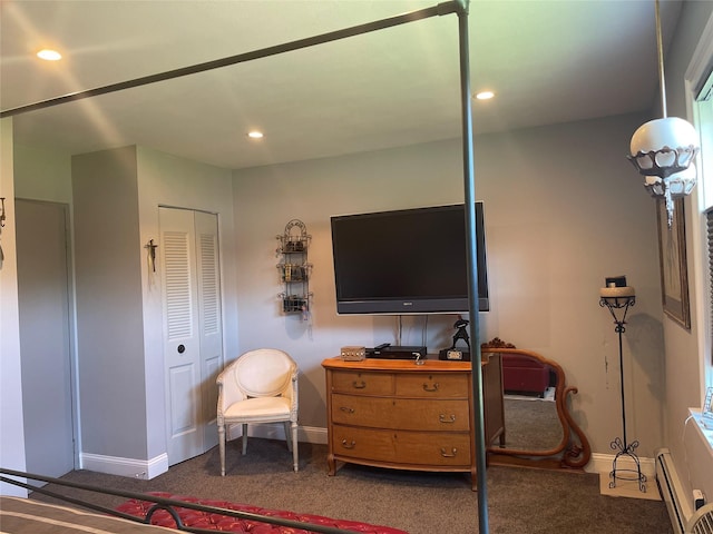 bedroom with baseboards, carpet, and a baseboard heating unit