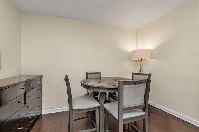 150-10 71st Ave Unit 5H, Kew Garden Hills, NY 11367 - dining area with baseboards and dark wood-style floors