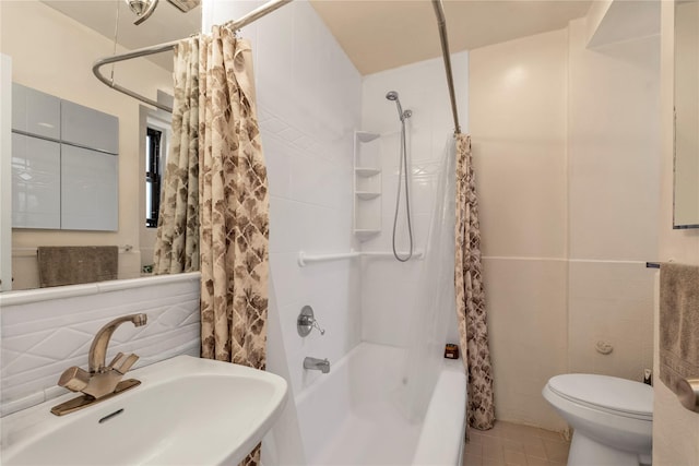 150-10 71st Ave Unit 5H, Kew Garden Hills, NY 11367 - full bathroom with toilet, shower / tub combo with curtain, a sink, and tile walls