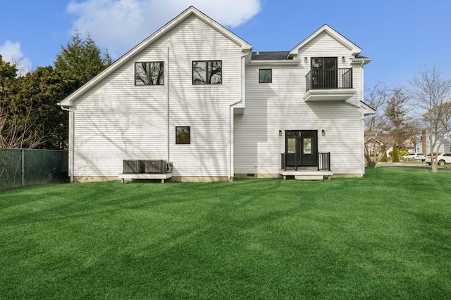 back of property featuring a balcony and cooling unit