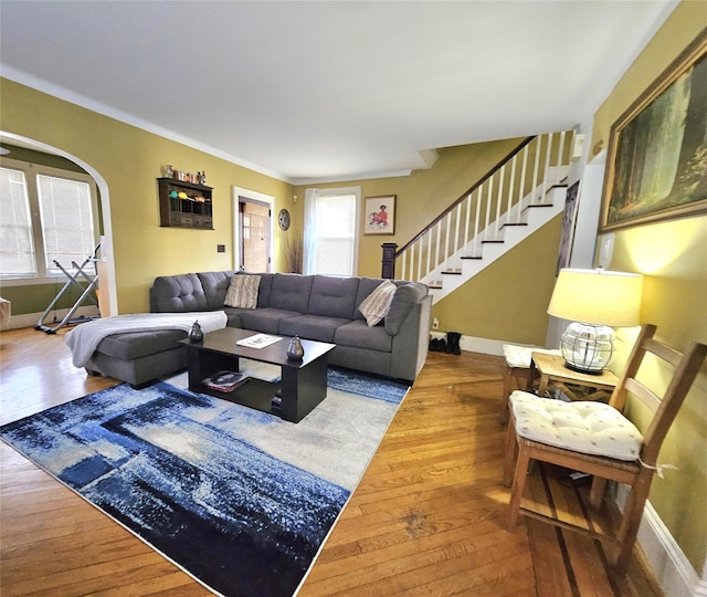 132-29 Brookville Blvd, Rosedale, NY 11422 - living room with wood-type flooring, stairway, baseboards, arched walkways, and ornamental molding