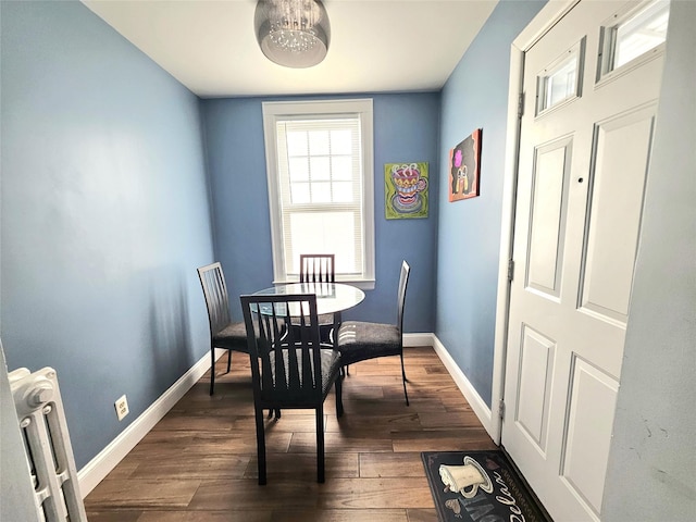 132-29 Brookville Blvd, Rosedale, NY 11422 - dining space featuring dark wood-type flooring and baseboards