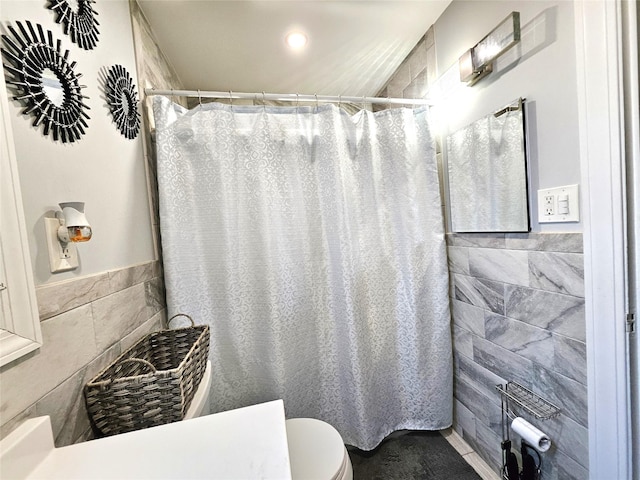 132-29 Brookville Blvd, Rosedale, NY 11422 - bathroom featuring tile walls, toilet, a shower with shower curtain, recessed lighting, and wainscoting
