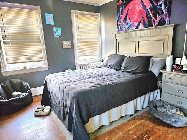 132-29 Brookville Blvd, Rosedale, NY 11422 - bedroom with wood finished floors, ornamental molding, and baseboards