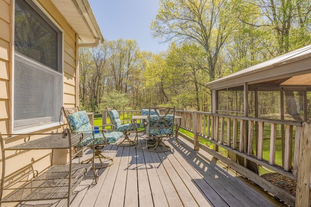 deck with outdoor dining area