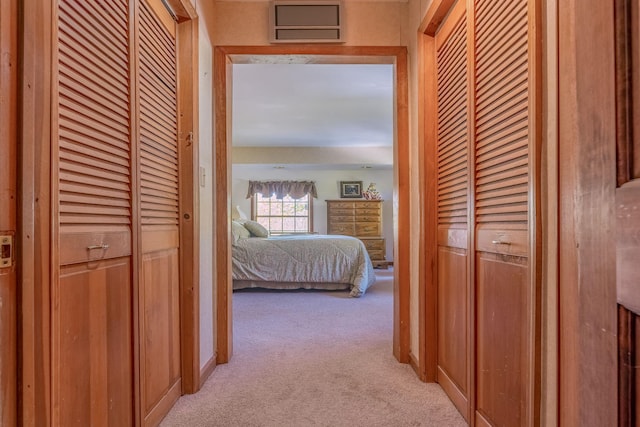 hallway with light carpet