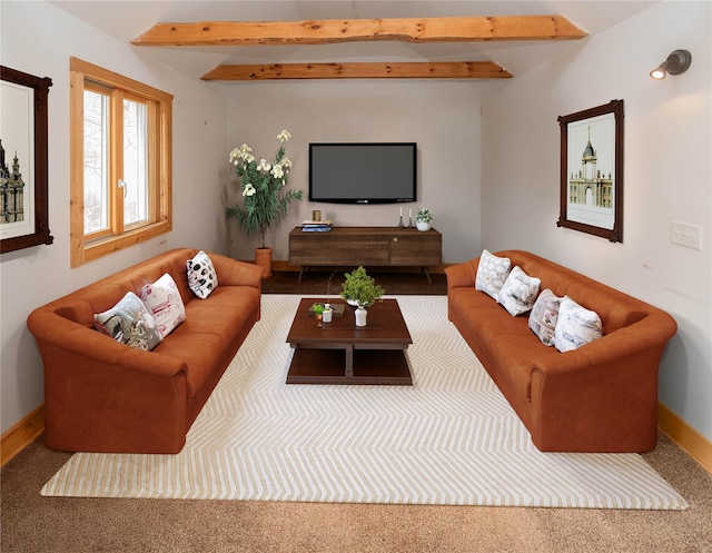 living room with beamed ceiling and baseboards