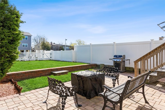 243 Sportsmans Ave, Freeport, NY 11520 - view of patio with a gate, grilling area, and a fenced backyard