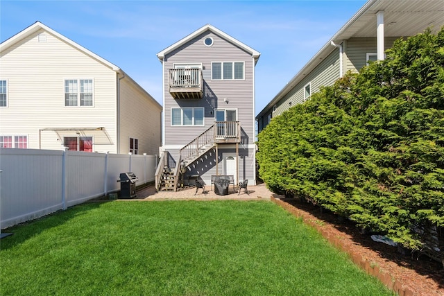 243 Sportsmans Ave, Freeport, NY 11520 - back of house with a yard, stairway, a balcony, and fence
