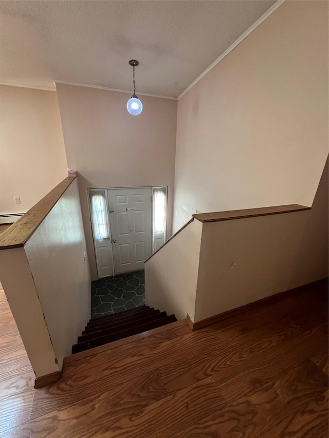 11 Keats Rd, Middletown, NY 10941 - stairs featuring ornamental molding, wood finished floors, and a textured ceiling