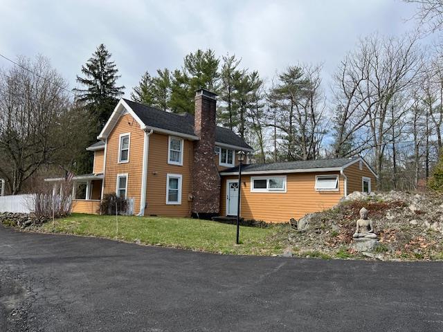 70 Mill Road Ext, Hyde Park, NY 12538 - view of front of property featuring a chimney and a front yard