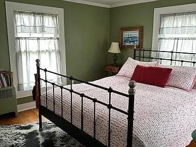 70 Mill Road Ext, Hyde Park, NY 12538 - bedroom with multiple windows, crown molding, and wood finished floors