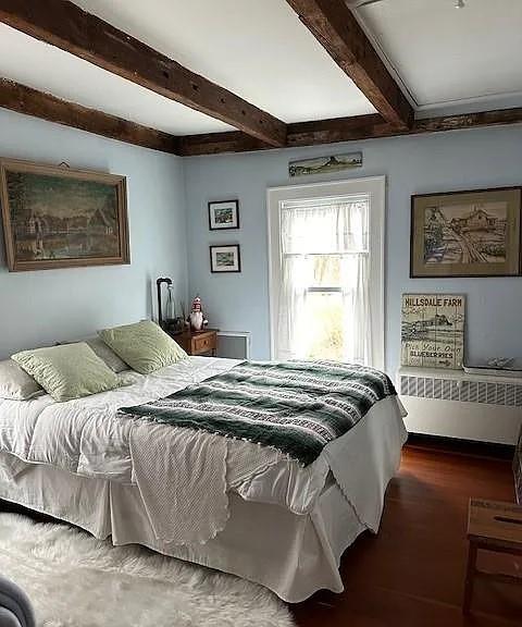 70 Mill Road Ext, Hyde Park, NY 12538 - bedroom featuring beam ceiling, wood finished floors, and radiator