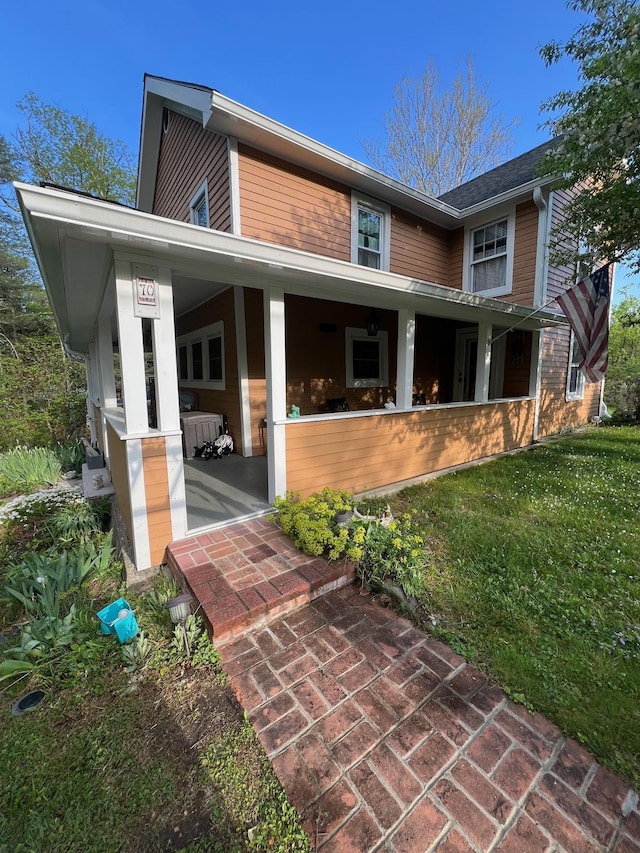 70 Mill Road Ext, Hyde Park, NY 12538 - rear view of property with a yard and covered porch