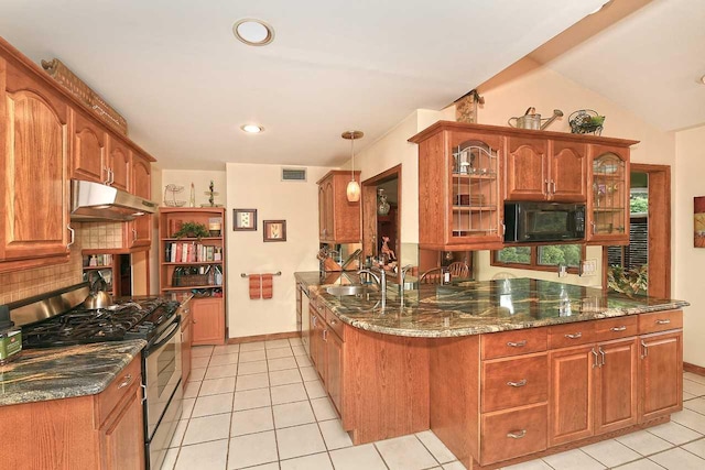 kitchen featuring light tile patterned floors, open shelves, black microwave, under cabinet range hood, and stainless steel gas stove