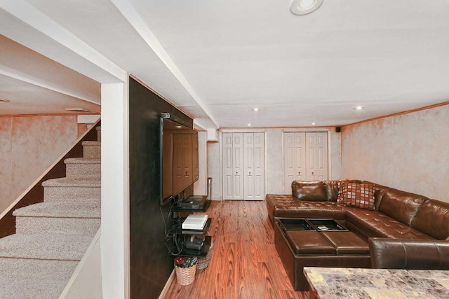 living area featuring stairway, wood finished floors, and recessed lighting