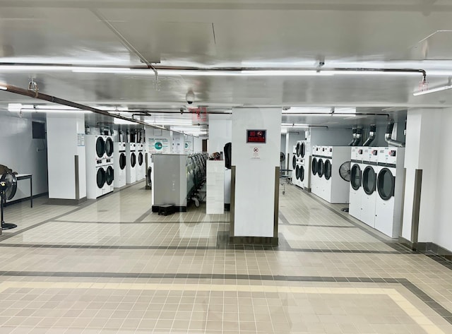 61-20 Grand Central Pkwy Unit A1503, Forest Hills, NY 11375 - interior space with stacked washer and dryer, baseboards, and washer and clothes dryer