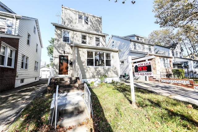 24027 Newhall Ave, Rosedale, NY 11422 - view of front of home featuring a garage