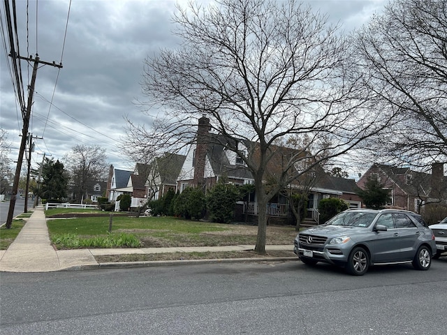 view of front of property with a front lawn and a residential view