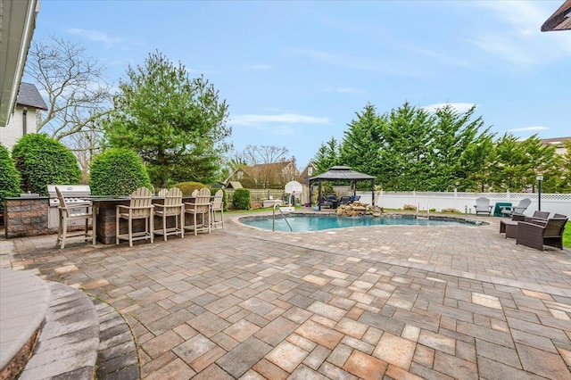 view of swimming pool with a gazebo, a fenced backyard, and a patio area