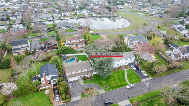 aerial overview of property's location with nearby suburban area and a large body of water