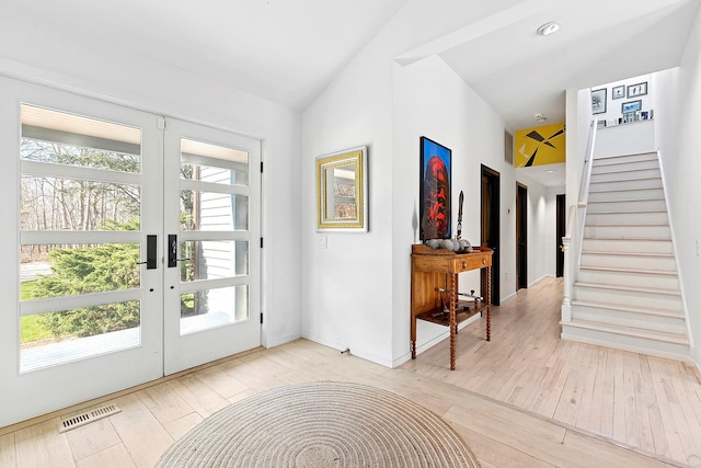 211 Red Dirt Rd, East Hampton, NY 11937 - entrance foyer with stairs, french doors, wood-type flooring, baseboards, and visible vents