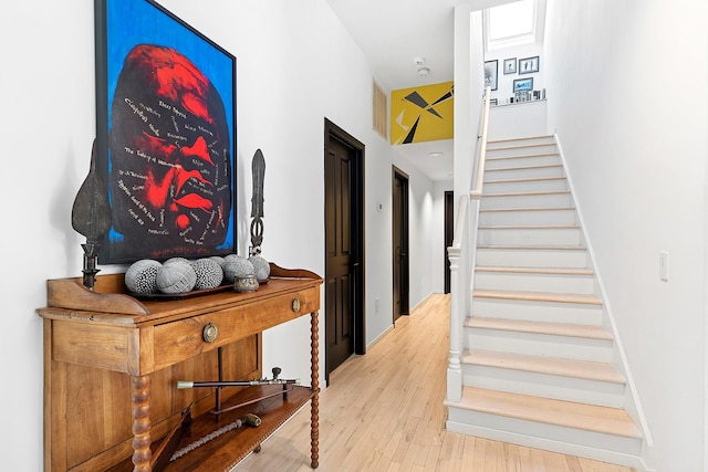 211 Red Dirt Rd, East Hampton, NY 11937 - stairs featuring wood finished floors and visible vents