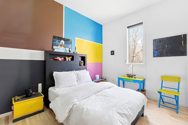 211 Red Dirt Rd, East Hampton, NY 11937 - bedroom with baseboards and wood finished floors