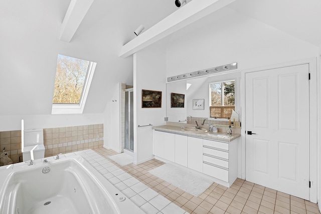 211 Red Dirt Rd, East Hampton, NY 11937 - full bath with a shower stall, tile patterned flooring, a jetted tub, vanity, and lofted ceiling with skylight