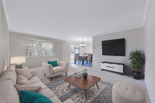 carpeted living room with a notable chandelier