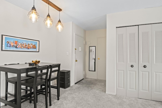 dining area featuring carpet