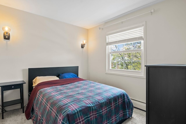 bedroom featuring a baseboard radiator and carpet