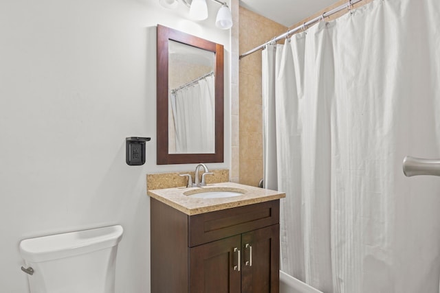 full bath with toilet and vanity