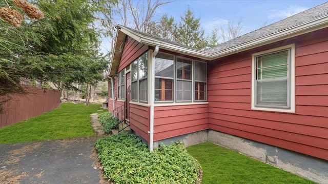 view of property exterior with a yard