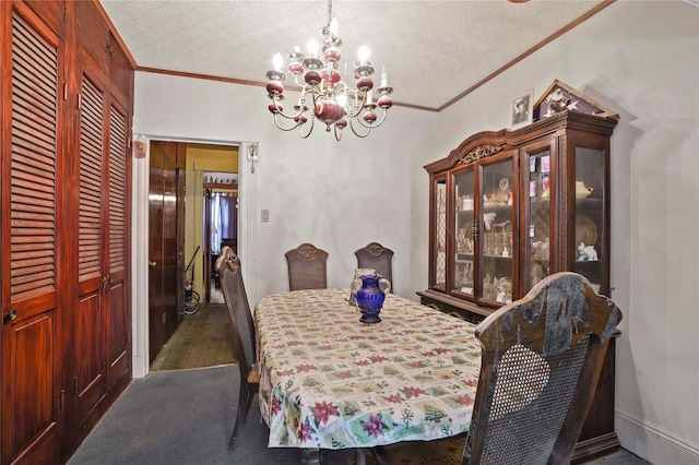 dining space featuring an inviting chandelier, ornamental molding, and dark carpet