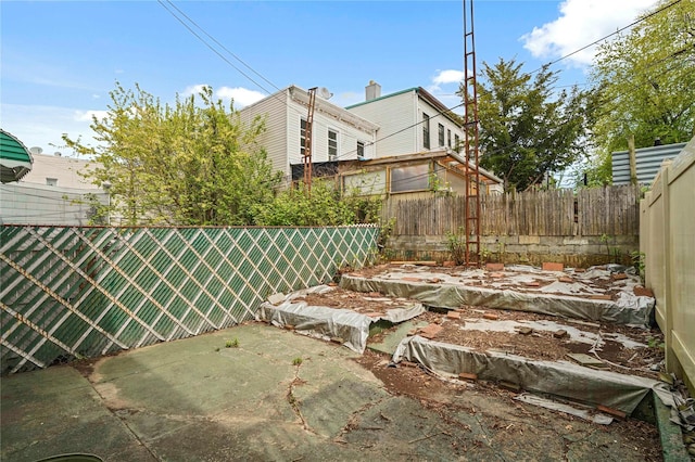 view of yard featuring a fenced backyard and a patio area