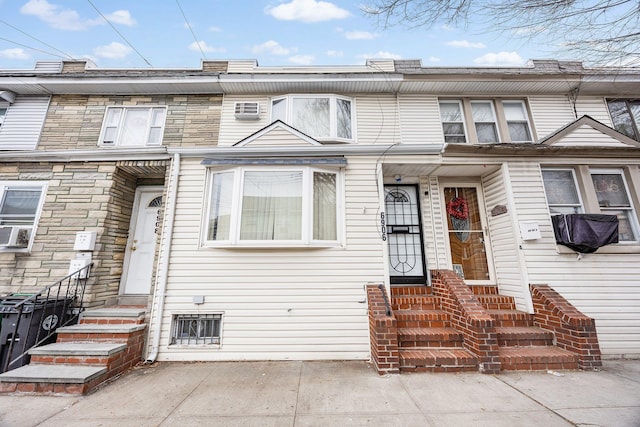 69-06 79th St, Middle Village, NY 11379 - townhome / multi-family property featuring entry steps and cooling unit
