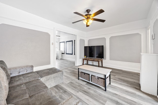 69-06 79th St, Middle Village, NY 11379 - living room featuring ceiling fan, wood finished floors, and baseboards