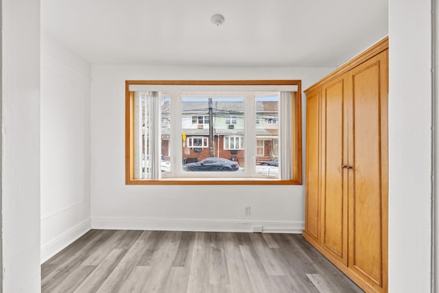 69-06 79th St, Middle Village, NY 11379 - unfurnished room with light wood-style floors and baseboards