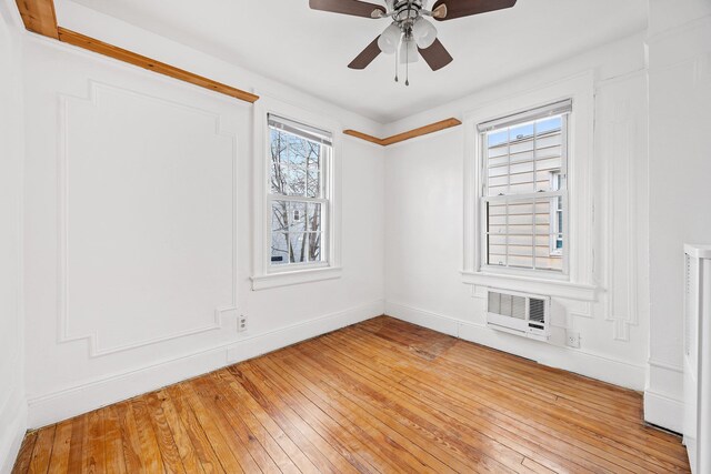 69-06 79th St, Middle Village, NY 11379 - spare room featuring light wood-type flooring, a ceiling fan, and baseboards